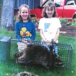 Racoons-In-Trap-Two-Girls-In-Yard